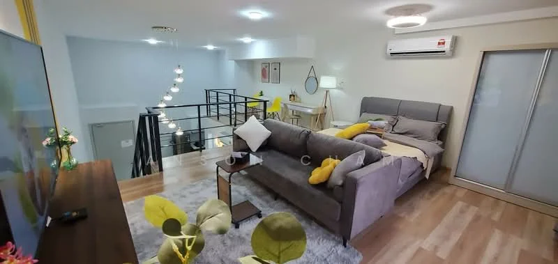 Living features: grey fabric sofa, yellow accent pillows, wooden coffee table, TV console, wall-mounted TV, area rug, laminate flooring, recessed downlights, ceiling-mounted air conditioning unit, decorative wall art, floor-to-ceiling windows, open-plan layout; style: modern. Room features: dining table with chairs, hanging pendant lights, staircase with metal railing, decorative plants.