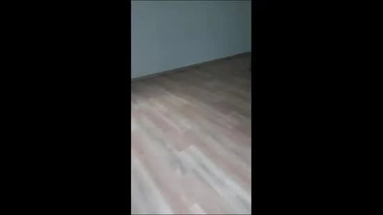 Room features: laminate flooring, white painted walls.
