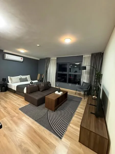 Living features: laminate flooring, grey accent wall, white painted walls, 5-blade ceiling fan with light, floor-to-ceiling windows, sheer curtains, sofa in dark fabric, coffee table in wood, area rug with circular pattern, TV console in wood, wall-mounted TV, decorative plant, reading lamp, bed with white bedding; style: modern; view: city.