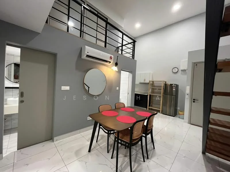 Dining features: 4-seater dining table, round dining table, red placemats, wooden chairs with rattan backs, white walls, grey accent wall, marble tile flooring, wall-mounted air conditioning unit, large round mirror, recessed downlights, open staircase, kitchen area visible in background; style: modern. Kitchen features: stainless-steel fridge, white cabinetry, countertop, sink visible, kitchen appliances visible; style: modern.