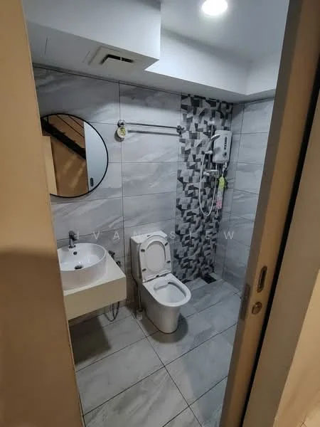 Bathroom features: white ceramic toilet, single-sink vanity with white cabinet, round mirror, shower with wall-mounted showerhead, grey and white patterned tile accent wall, grey marble tile flooring, recessed ceiling lights, wall-mounted water heater; style: modern.