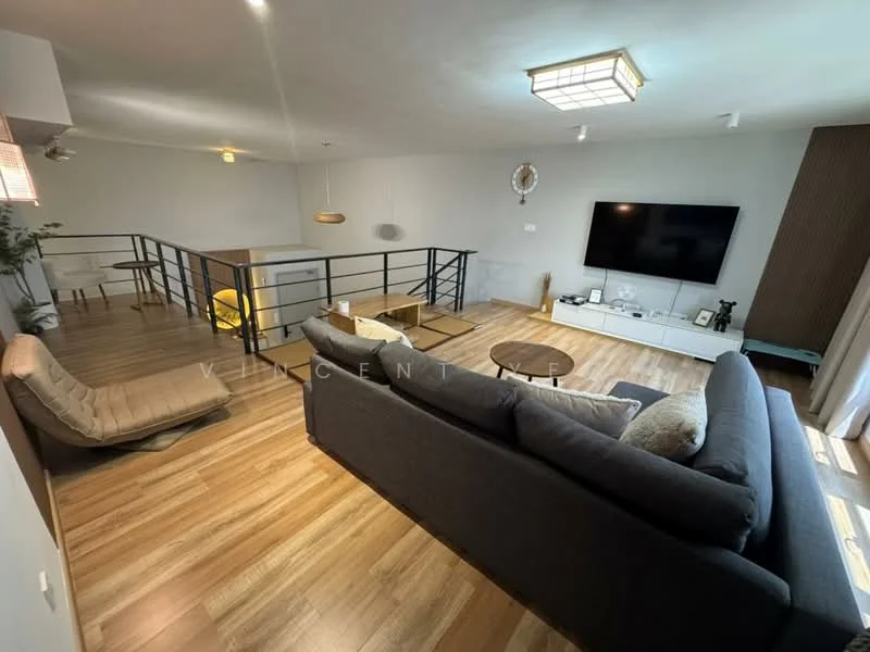 Living features: grey fabric sectional sofa, wooden coffee table, flat-screen TV on white console, wooden flooring, recessed ceiling lights, pendant light fixture, black metal railing, large window with sheer curtains, decorative wall paneling, area rug; style: modern.