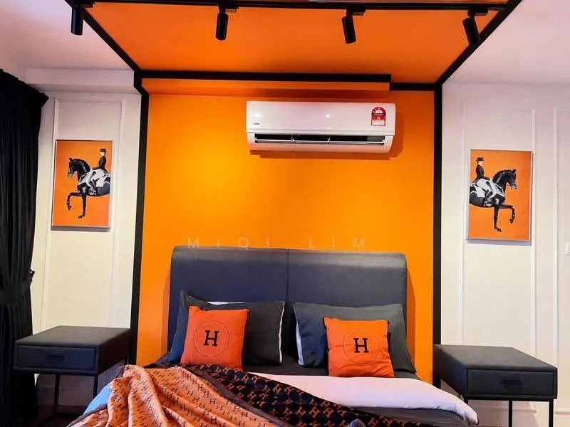 Bedroom features: orange painted walls, black curtains, grey upholstered bed frame, orange and black decorative pillows, framed artwork on walls, 1 wall-mounted split AC, track lighting, bedside tables with drawers, decorative throw blanket; style: modern.