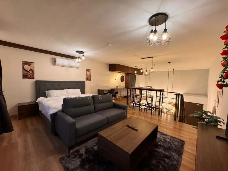 Living features: grey fabric sofa, wood coffee table, area rug with geometric pattern, wall-mounted air conditioning unit, pendant lighting, wooden flooring, decorative wall art, open-plan layout with dining area; style: modern.