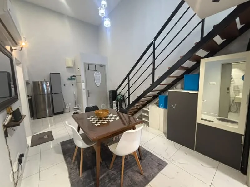 Dining features: dining table with checkered pattern, 4 white upholstered dining chairs, grey area rug, pendant lighting fixtures, high ceiling, white walls, marble tile flooring, open layout to living area, staircase with wooden steps and metal railing, wall-mounted mirror, refrigerator, kitchenette with cabinets; style: modern.