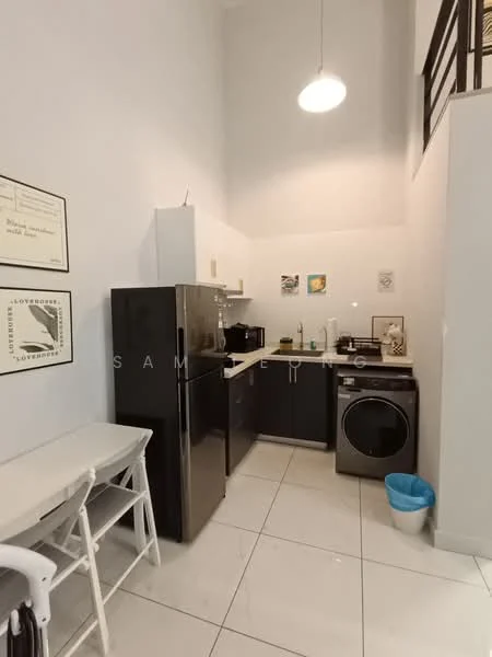 Kitchen features: black refrigerator, black built-in oven, black countertop, white upper cabinets, grey lower cabinets, stainless-steel sink, chrome pull-down faucet, washing machine, white tiled flooring, pendant light, wall-mounted artwork, open shelving, small dining table with chairs; style: modern.