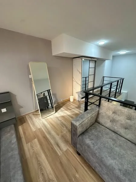 Living features: grey fabric sofa, wooden flooring, mirror, recessed downlights, white walls, black railing, light fixture, sliding glass door, decorative plant; style: modern.