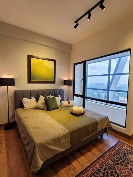 Bedroom features: king-size bed, upholstered headboard, decorative throw pillows, bedside lamps, wooden flooring, large window with city view, framed artwork on wall, area rug with intricate pattern, track lighting; style: modern; view: city.