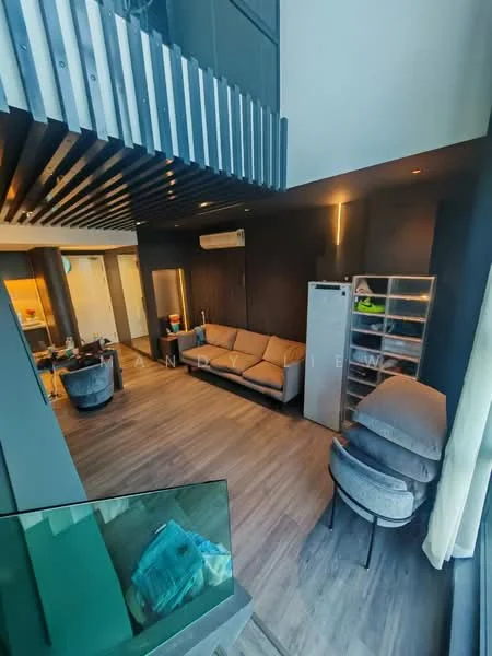 Living features: 3-seater fabric sofa in beige, 2 armchairs in grey, coffee table, TV console, wall-mounted TV, wooden flooring, recessed downlights, air conditioning unit, open shelving unit, large windows with sheer curtains, decorative wall paneling, high ceiling with exposed beams; style: modern. Kitchen features: stainless-steel fridge, open kitchen layout, kitchen island, pendant lighting, wooden cabinetry, ceramic tile backsplash; style: modern.