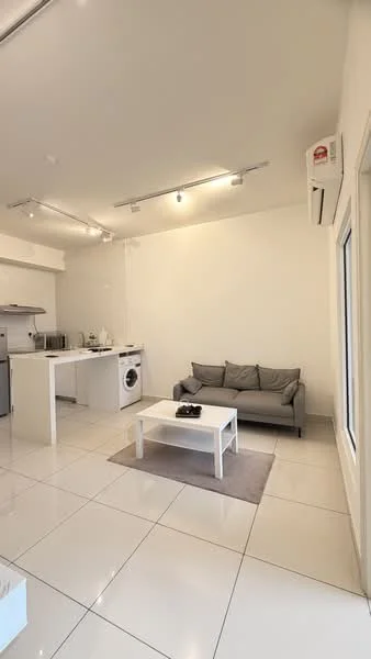 Living features: grey fabric sofa, white coffee table, area rug, wall-mounted split AC, recessed LED downlights, white painted walls, glossy tile flooring, washing machine, kitchenette with stainless-steel appliances; style: modern.
