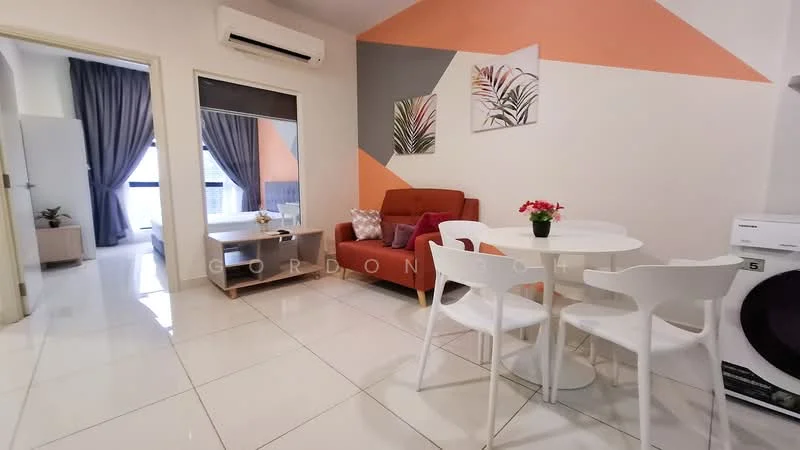 Living features: white painted walls, orange accent wall, grey curtains, white round dining table, 4 white dining chairs, red fabric sofa, decorative plant on table, tile flooring, air conditioning unit, washing machine; style: modern. Room features: doorway leading to another room, light-colored furniture.