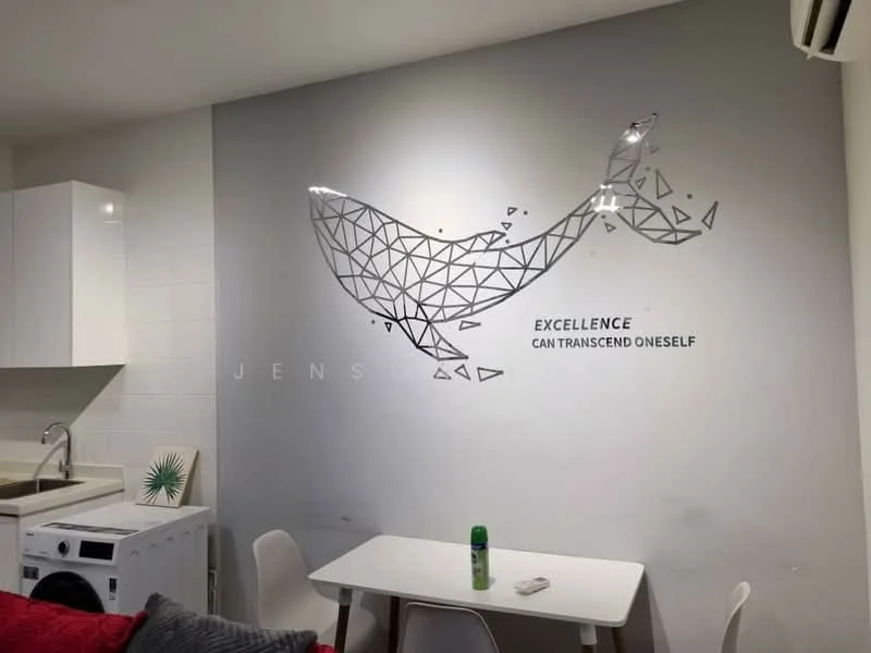 Room features: white painted walls, grey accent wall with geometric whale design, white cabinetry, kitchen sink, washing machine, small dining table, white chairs, green bottle on table, recessed lighting, air conditioning unit; style: modern.