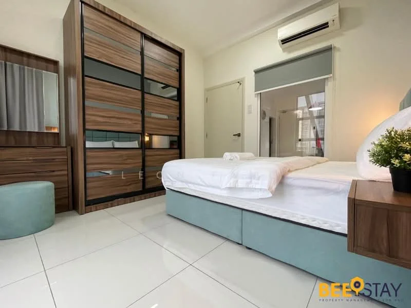 Bedroom features: king-size bed with white bedding, upholstered headboard in light blue, wooden bedside table, built-in wardrobe with sliding glass doors, dressing table with mirror, round upholstered stool, white tiled flooring, wall-mounted air conditioning unit, curtains on window, decorative wall art; style: modern.