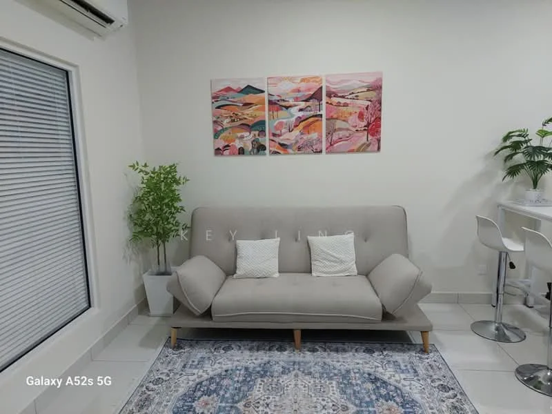 Living features: 3-seater fabric sofa in light grey, 2 decorative cushions, framed artwork with landscape theme, area rug with geometric pattern, potted plant, white wall, sliding glass door, tile flooring, ceiling-mounted air conditioning unit, bar stools at counter; style: modern.