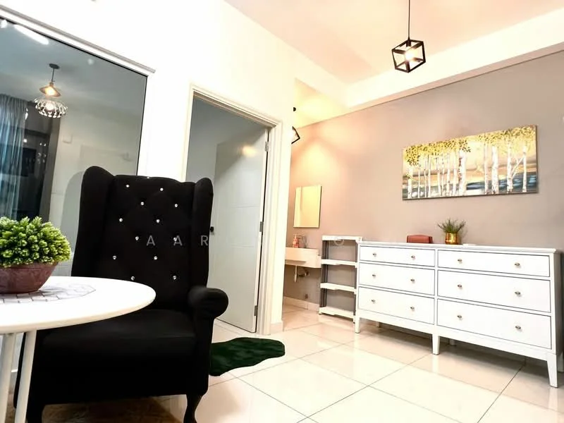 Living features: black upholstered armchair with tufted back, white round coffee table, white dresser with multiple drawers, decorative wall art with trees, green potted plant, white tiled flooring, recessed ceiling lights, hanging pendant light, mirror above dresser, green area rug; style: modern. Room features: white painted walls, doorway leading to another room, light fixture.