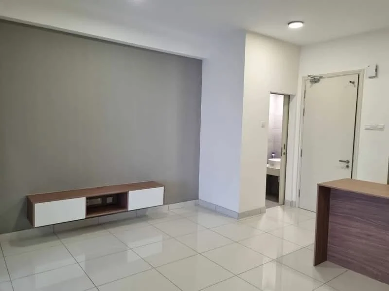 Living features: grey accent wall, white painted walls, glossy white tile flooring, built-in TV console with wood finish, open layout, recessed ceiling lights, doorway leading to bathroom, corner space for furniture; style: modern.