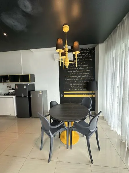 Dining features: round dining table with black top, yellow pedestal base, 4 grey plastic dining chairs, black pendant light fixture with yellow accents, white sheer curtains, black accent wall with text, cream tiled flooring, kitchen cabinetry with black and yellow accents, 2 stainless-steel refrigerators; style: modern.