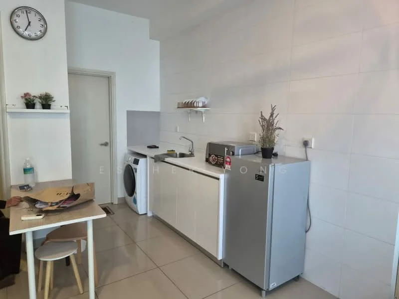 Kitchen features: white cabinetry, grey countertop, stainless-steel fridge, built-in washing machine, single-bowl stainless-steel sink, chrome pull-down faucet, white tiled walls, ceramic tile flooring, wall-mounted shelf, clock on wall, decorative plants, water bottle on counter; style: modern.