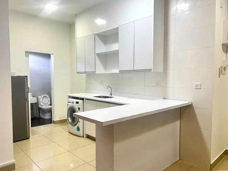 Kitchen features: white cabinetry, white countertop, single-bowl stainless-steel sink, chrome pull-down faucet, built-in washing machine, refrigerator, tile backsplash, cream tiled flooring, recessed downlights; style: modern. Bathroom features: toilet, grey tiled walls, grey tiled flooring.