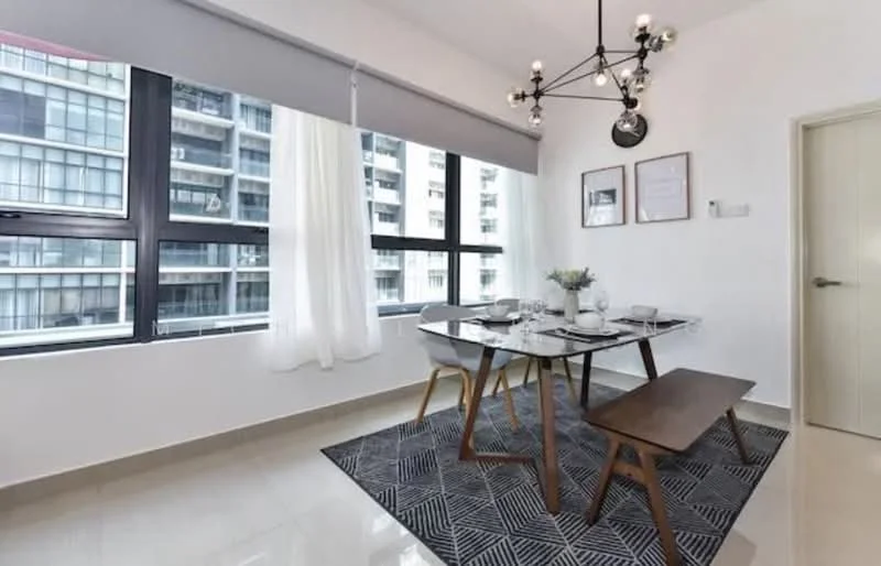 Dining features: dining table with 4 chairs, wooden bench seating, chandelier light fixture, large windows with sheer curtains, grey patterned area rug, white painted walls, glossy tile flooring, framed artwork on walls; style: modern; view: city.