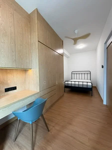Bedroom features: wooden flooring, light wood panelled walls, black metal bed frame, single bed, built-in wardrobe with sliding doors, study desk with built-in lighting, blue plastic chair, ceiling fan, white ceiling, window with natural light; style: modern.