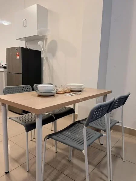 Dining features: square dining table with light wood top, 4 grey plastic dining chairs with perforated design, white ceramic plates, glass cups, white kettle, black refrigerator, white cabinet above the table, tile flooring in beige, wall-mounted lamp, neutral painted walls; style: modern.