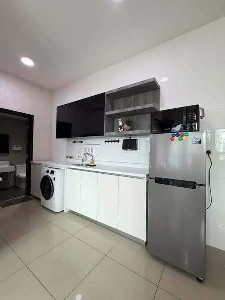 Kitchen features: white cabinetry, grey countertop, stainless-steel fridge, built-in microwave, single-bowl stainless-steel sink, chrome pull-down faucet, washing machine, wall-mounted shelf, tile backsplash, ceramic tile flooring, recessed downlights, wall-mounted TV, decorative plants; style: modern.
