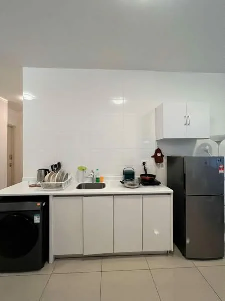 Kitchen features: white cabinetry, stainless-steel sink, chrome pull-down faucet, built-in refrigerator, black front-load washing machine, white countertop, ceramic tile flooring, dish rack, kitchen utensils, small kitchen appliances; style: modern.