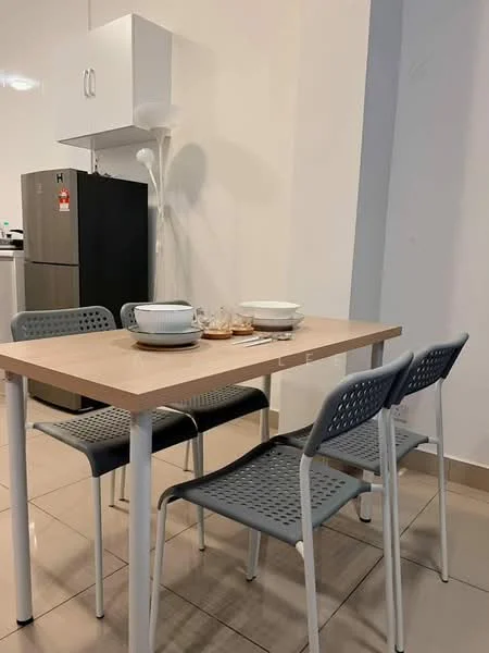 Dining features: light wood dining table, 4 grey plastic chairs with perforated design, white ceramic plates, glass cups, cutlery, white cabinet above the table, black refrigerator in the background, tiled flooring in beige, white walls, floor lamp; style: modern.