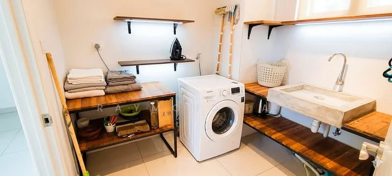 Laundry features: white front-load washing machine, concrete utility sink, wooden countertop, open shelving, black metal shelving brackets, stacked towels, basket for storage, wall-mounted iron, tile flooring, white walls, LED strip lighting; style: modern.