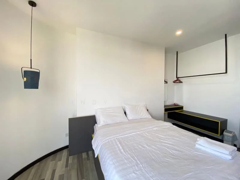 Bedroom features: queen-size bed with white bedding, wooden flooring, white painted walls, pendant light fixture, built-in wardrobe with black trim, nightstand with drawer, window with natural light, minimalist decor; style: modern.