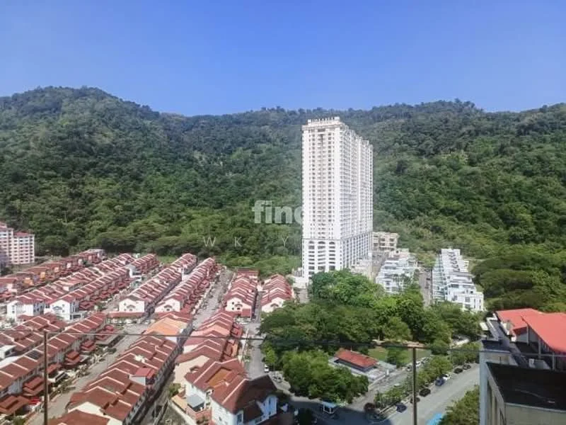 Exterior type: high-rise condominium; features: tall residential building, surrounded by greenery, mountain backdrop, urban landscape, multiple floors, modern architecture, adjacent low-rise houses, clear blue sky; style: modern.