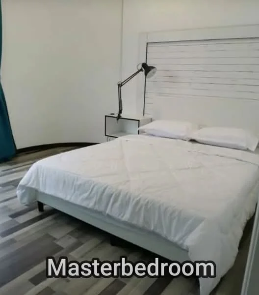 Bedroom features: queen-size bed with white bedding, wooden headboard with slatted design, nightstand with lamp, blue curtain, laminate flooring with wood pattern, white painted walls, recessed lighting, wall-mounted reading lamp; style: modern.
