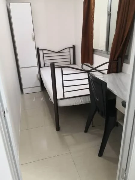 Bedroom features: single bed frame with mattress, white wardrobe, desk with marble top, black chair, floor-to-ceiling window, brown curtains, tiled flooring, white painted walls.