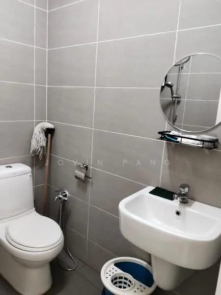 Bathroom features: white one-piece toilet, chrome basin mixer faucet, round mirror, white wall-mounted sink, grey tiled walls, grey floor tiles, handheld shower, toilet paper holder, mop, shower hose; style: modern.