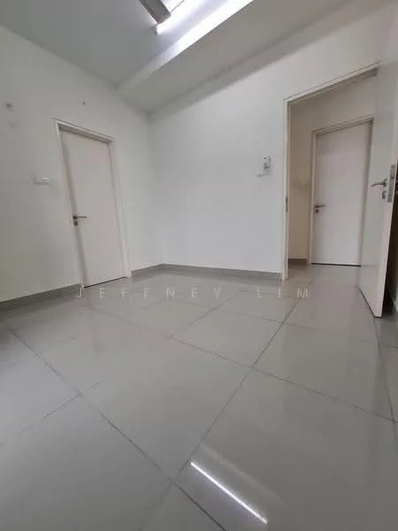 Room features: white painted walls, grey floor tiles, two doors, ceiling light, no visible furniture, minimal decor, corner space, neutral color scheme; style: minimalist.