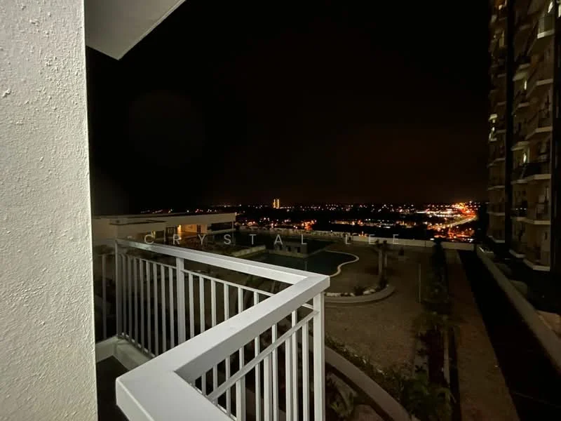 Room features: balcony with white railing, night view of city skyline, landscaped area visible below, outdoor space with gravel surface; view: city.