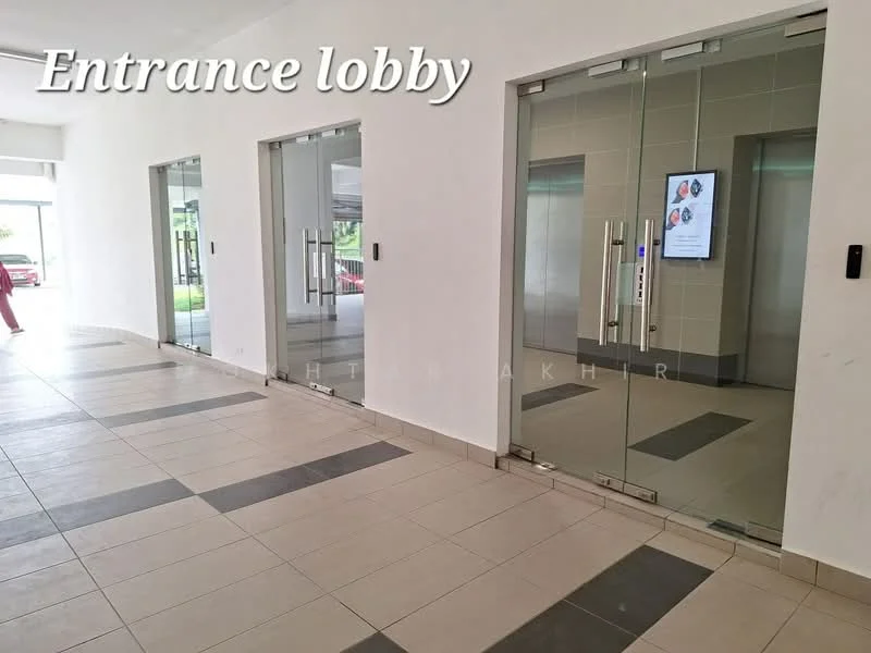Lobby features: glass doors, tiled flooring in grey and cream, recessed lighting, elevator access, digital display screen, white painted walls, open layout, natural light from windows; style: modern; view: garden.
