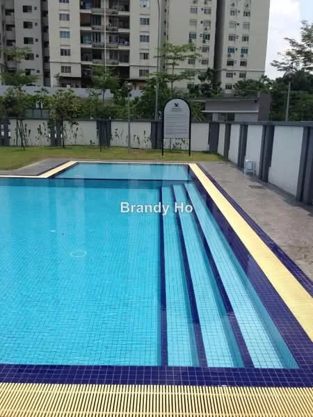 Exterior type: swimming pool deck; features: infinity edge pool, blue mosaic tile lining, pool deck with loungers, surrounding landscaped area, fenced perimeter, visible residential building in background; style: modern.