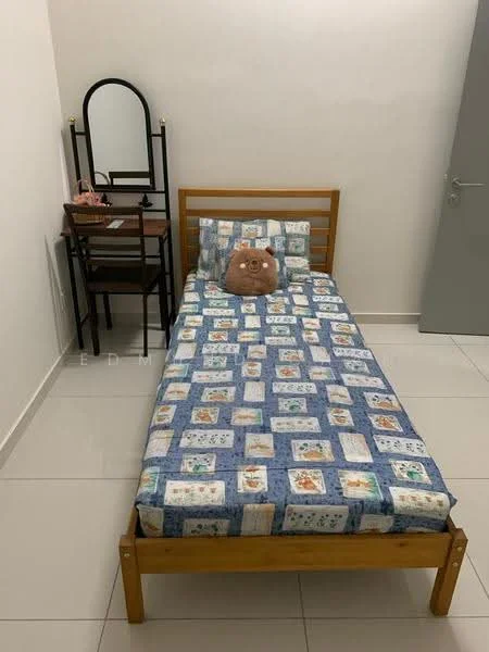 Bedroom features: single bed, wooden bed frame, blue patterned bedspread, pillow with animal design, white painted walls, tile flooring, mirror on wooden dressing table, wooden dressing table, pink cosmetic items on table, chair next to dressing table.