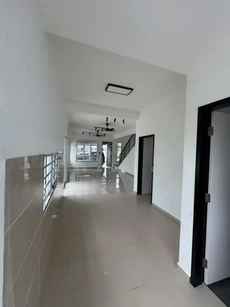 Room features: white painted walls, light grey tiled flooring, ceiling with recessed lighting, black ceiling fan, open layout, staircase visible in background, doorway leading to another room, large windows for natural light; style: modern.