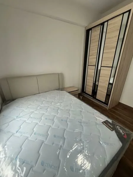 Bedroom features: queen-size bed with mattress, upholstered headboard, wooden bedside table, built-in wardrobe with sliding doors, wooden flooring, white painted walls, natural light from window, decorative wall paneling; style: modern.