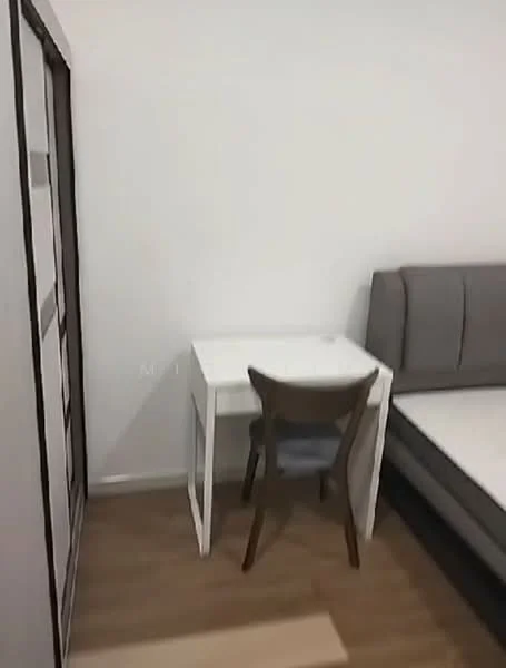 Room features: white walls, laminate flooring, single bed, grey upholstered headboard, white desk, wooden chair, built-in wardrobe with sliding doors; style: modern.