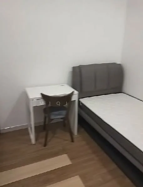 Bedroom features: grey upholstered headboard, single bed frame without mattress, white desk, wooden chair, laminate flooring, white painted walls, window with no visible treatment; style: minimalist.