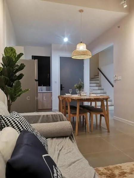 Living features: grey fabric sofa, decorative throw pillows, wooden dining table, 4 wooden dining chairs, pendant light fixture, potted plant, tile flooring, white painted walls, staircase in background; style: modern.