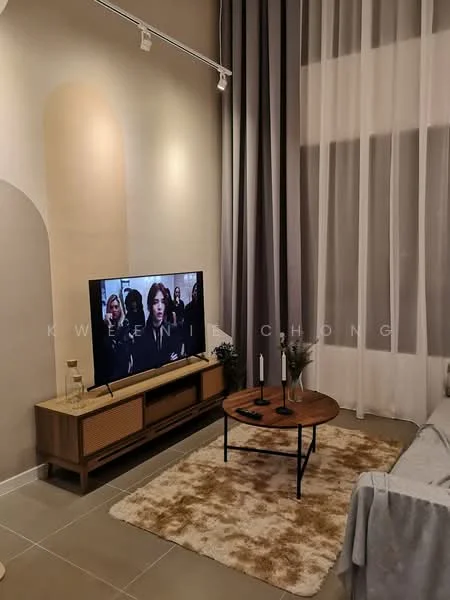 Living features: floor-to-ceiling windows, sheer curtains, grey accent wall, cream painted walls, light-colored sofa, wooden TV console, flat-screen TV, round coffee table, area rug with geometric pattern, decorative candles, small potted plants, recessed lighting; style: modern.