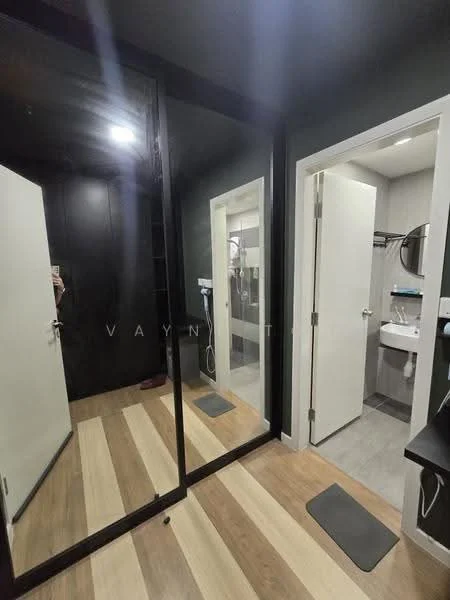 Room features: mirrored wardrobe, white doors, black accent wall, wooden flooring, grey tile flooring, recessed lighting, wall-mounted mirror, hanging clothes rack; style: modern.