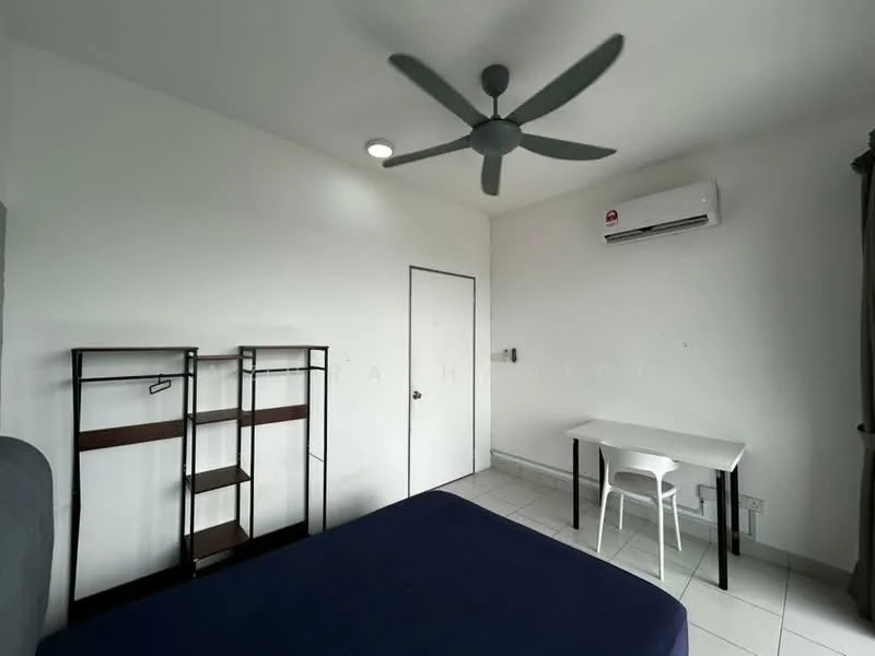 Bedroom features: white painted walls, tile flooring, 5-blade ceiling fan, wall-mounted split AC, double bed with blue bedding, study desk with white chair, open shelving unit, door, window with curtain; style: modern.