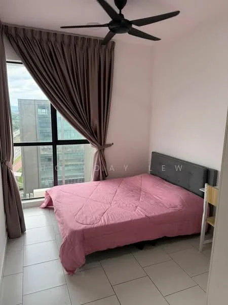 Bedroom features: king-size bed with pink bedspread, grey upholstered headboard, floor-to-ceiling windows, black ceiling fan, curtains in light brown, white painted walls, tile flooring, small wooden chair; style: modern; view: city.