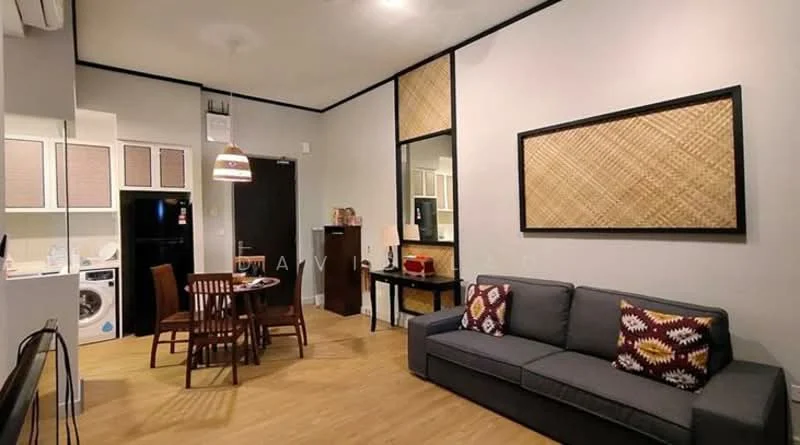 Living features: grey fabric sofa, decorative cushions with geometric pattern, wooden dining table for four, wooden dining chairs, black console table, wall-mounted artwork, laminate flooring, recessed ceiling lights, open-plan layout with kitchen, kitchen cabinetry with white finish, black refrigerator, washing machine, kitchen countertop with backsplash; style: modern.